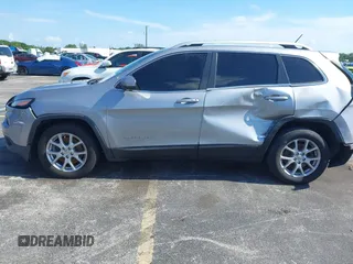 2014 Jeep Cherokee Latitude with VIN 1C4PJLCS6EW103423, listed as a IAAI auction lot 40118289 with 112,120 mi miles and . Bid and sale history available at DreamBid. Image 14.