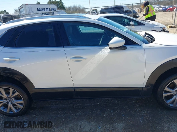 2022 Mazda CX-30 S Premium with VIN 3MVDMBDL1NM413540, listed as a IAAI auction lot 41681191 with 57,764 mi miles and . Bid and sale history available at carsss.com. Image 14.