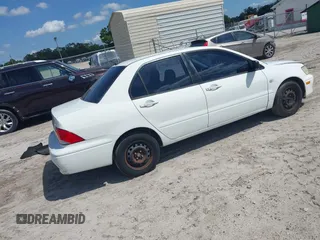 2002 Mitsubishi Lancer ES with VIN JA3AJ26E42U054430, listed as a IAAI auction lot 41918246 with 192,996 mi miles. Bid and sale history available at carsss.com. Image 4.