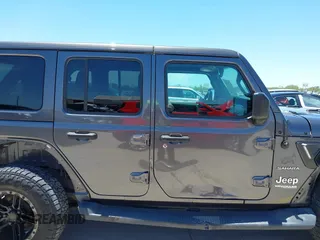 2018 Jeep Wrangler Unlimited Sahara with VIN 1C4HJXEN1JW236779, listed as a IAAI auction lot 42238158 with 72,879 mi miles and . Bid and sale history available at DreamBid. Image 14.