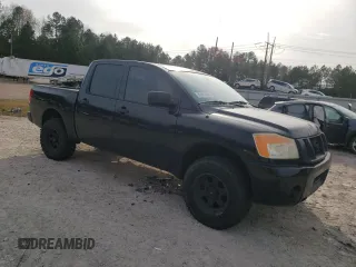 2010 Nissan Titan XE with VIN 1N6AA0EJ1AN323185, listed as a Copart auction lot 82813644 with 154,493 mi miles and Clean Title. Bid and sale history available at carsss.com. Image 4.