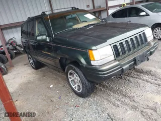 1997 Jeep Grand Cherokee Limited with VIN 1J4GZ78Y5VC723429, listed as a IAAI auction lot 42012836 with 231,126 mi miles. Bid and sale history available at carsss.com. Image 1.