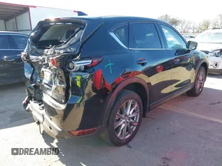 2021 Mazda CX-5 Grand Touring with VIN JM3KFADM1M0406098, listed as a IAAI auction lot 41654735 with 33,050 mi miles. Bid and sale history available at carsss.com. Image 4.