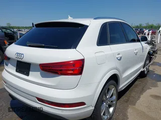 2018 Audi Q3 Premium with VIN WA1BCCFS4JR000455, listed as a IAAI auction lot 42042811 with 57,354 mi miles. Bid and sale history available at carsss.com. Image 4.