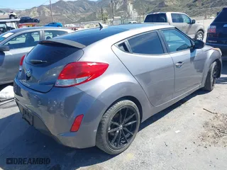 2015 Hyundai Veloster with VIN KMHTC6AD1FU233648, listed as a IAAI auction lot 41822881 with 162,368 mi miles. Bid and sale history available at carsss.com. Image 4.