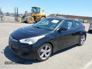 2013 Hyundai Veloster w/Black Int with VIN KMHTC6AD2DU144376, listed as a IAAI auction lot 42720882 with 143,023 mi miles and . Bid and sale history available at DreamBid. Image 2.