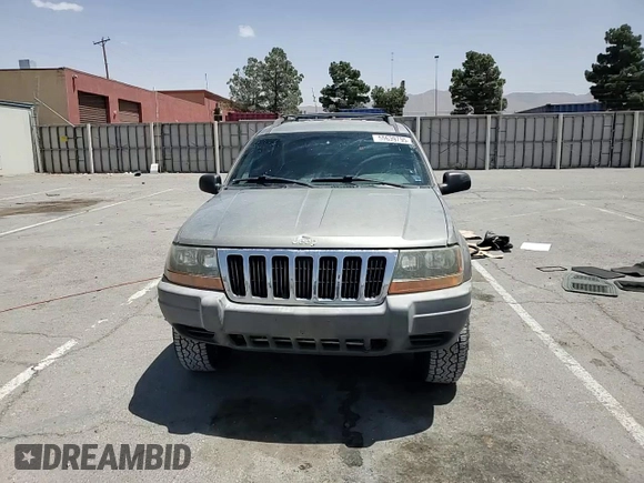 1999 Jeep Grand Cherokee Laredo with VIN 1J4GW58S1XC775877, listed as a Copart auction lot 55639795 with 197,611 mi miles and Salvage title. Bid and sale history available at DreamBid. Image 14.