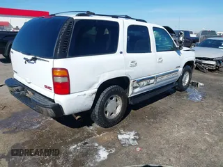 2003 GMC Yukon SLT with VIN 1GKEC13Z13J197955, listed as a IAAI auction lot 41586841 with 208,752 mi miles. Bid and sale history available at carsss.com. Image 4.
