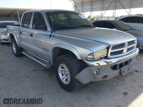 2002 Dodge Dakota SLT with VIN 1B7HG48N62S546119, listed as a IAAI auction lot 41826998 with 157,761 mi miles. Bid and sale history available at carsss.com. Image 1.