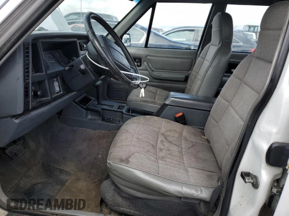 1995 Jeep Cherokee Sport z VIN 1J4FJ68S8SL650142, wystawiony jako Copart lot #51923775 z przebiegiem 329 796 mil mil oraz Czysty tytuł • Clean title. Historia ofert i sprzedaży dostępna na DreamBid. Obrazek 7.