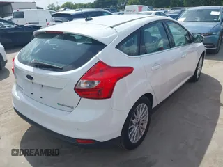 2014 Ford Focus Electric with VIN 1FADP3R49EL355751, listed as a IAAI auction lot 42628237 with 56,551 mi miles and . Bid and sale history available at DreamBid. Image 4.
