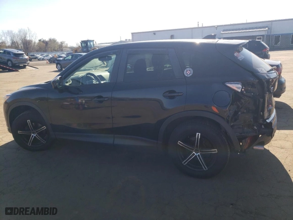 2015 Mazda CX-5 Touring with VIN JM3KE4CY5F0453789, listed as a Copart auction lot 53401615 with 204,305 mi miles and Salvage Title. Bid and sale history available at carsss.com. Image 2.