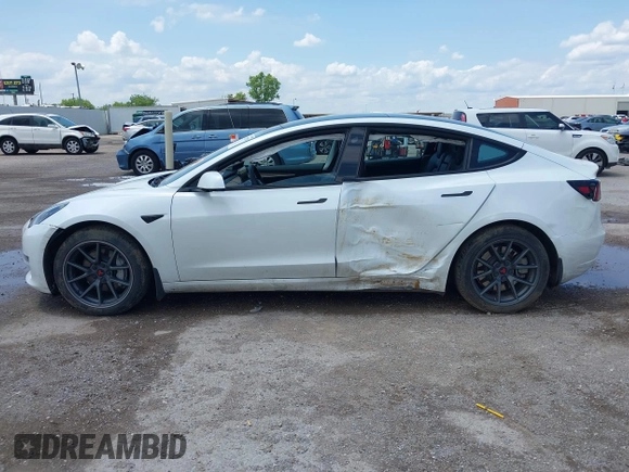 2023 Tesla Model 3 with VIN 5YJ3E1EA5PF407054, listed as a IAAI auction lot 42313770 with 57,621 mi miles and . Bid and sale history available at DreamBid. Image 14.