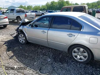 2008 Kia Optima LX z VIN KNAGE123385225909, wystawiony jako IAAI lot #42184219 z przebiegiem 118 300 mil mil oraz . Historia ofert i sprzedaży dostępna na DreamBid. Obrazek 14.