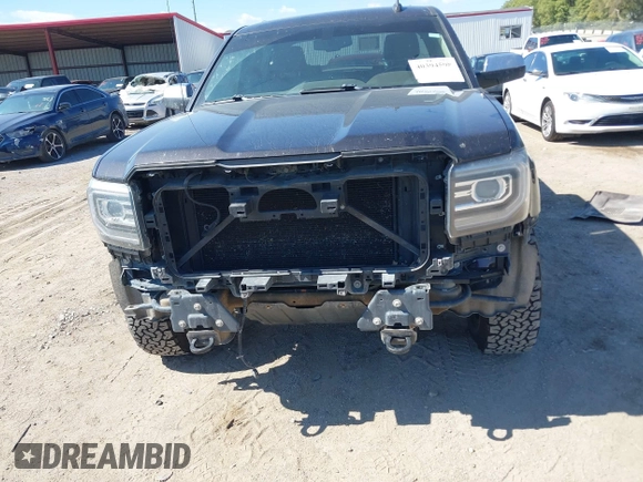 2016 GMC Sierra 1500 SLT with VIN 3GTU2NEC4GG285688, listed as a IAAI auction lot 40394598 with 121,940 mi miles and . Bid and sale history available at DreamBid. Image 6.