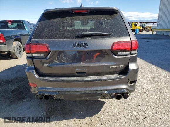 2018 Jeep Grand Cherokee Trackhawk with VIN 1C4RJFN96JC377074, listed as a Copart auction lot 53305975 with 27,625 mi miles and Salvage title. Bid and sale history available at DreamBid. Image 6.