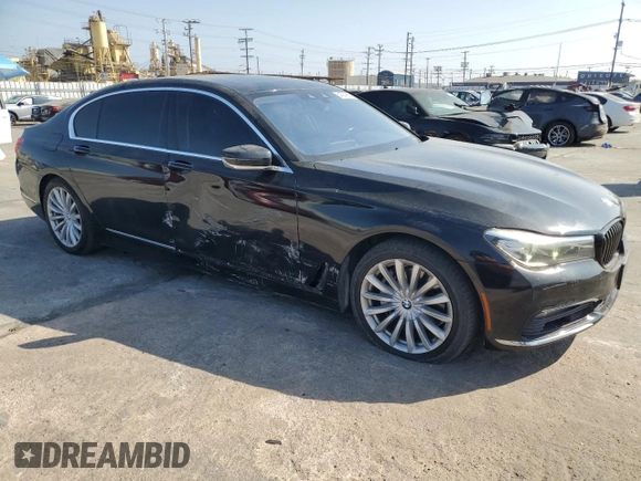 2017 BMW 7 Series 740i with VIN WBA7E2C50HG739565, listed as a Copart auction lot 64584885 with 114,496 mi miles and Salvage title. Bid and sale history available at DreamBid. Image 4.