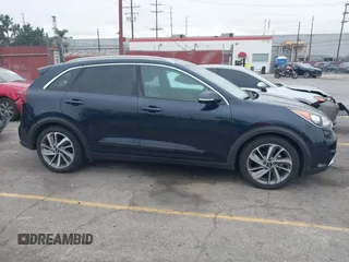 2017 Kia Niro Touring with VIN KNDCE3LC6H5048381, listed as a IAAI auction lot 42035129 with 133,559 mi miles. Bid and sale history available at carsss.com. Image 13.