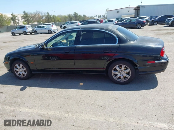 2003 Jaguar S-Type with VIN SAJEA01T13FM70486, listed as a IAAI auction lot 41989501 with 100,109 mi miles and . Bid and sale history available at DreamBid. Image 14.