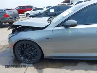 2023 Cadillac CT5 Sport z VIN 1G6DP5RK7P0113696, wystawiony jako IAAI lot #41904906 z przebiegiem 89 191 mil mil oraz . Historia ofert i sprzedaży dostępna na DreamBid. Obrazek 21.