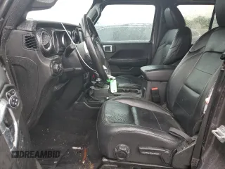 2020 Jeep Wrangler Unlimited Sahara Altitude with VIN 1C4HJXEM5LW293741, listed as a Copart auction lot 58801565 with 97,460 mi miles and Salvage title. Bid and sale history available at DreamBid. Image 7.