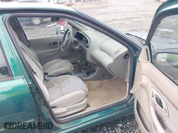 1999 Ford Contour SE Fleet with VIN 1FAFP66L3XK227522, listed as a IAAI auction lot 41702873 with 140,926 mi miles. Bid and sale history available at carsss.com. Image 5.