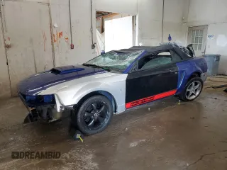 2004 Ford Mustang Deluxe with VIN 1FAFP44684F189081, listed as a Copart auction lot 59474985 with 249,812 mi miles and Salvage title. Bid and sale history available at DreamBid. Image 1.
