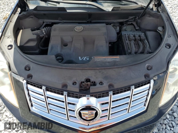 2014 Cadillac SRX with VIN 3GYFNAE38ES572951, listed as a Copart auction lot 53033685 with 104,204 mi miles and Salvage Title. Bid and sale history available at DreamBid. Image 12.