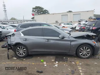 2014 Infiniti Q50 Premium z VIN JN1BV7AP8EM674625, wystawiony jako IAAI lot #41922173 z przebiegiem Nie podano mil oraz . Historia ofert i sprzedaży dostępna na DreamBid. Obrazek 13.