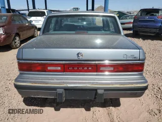 1991 Dodge Dynasty LE z VIN 1B3XC56R9MD115785, wystawiony jako Copart lot #48073715 z przebiegiem 64 483 mil mil oraz Szkoda całkowita • Salvage title. Historia ofert i sprzedaży dostępna na DreamBid. Obrazek 6.