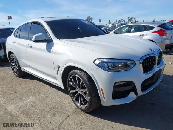 2021 BMW X4 xDrive30i with VIN 5UX2V1C0XM9E90574, listed as a IAAI auction lot 41422478 with NaN miles. Bid and sale history available at carsss.com. Image 1.