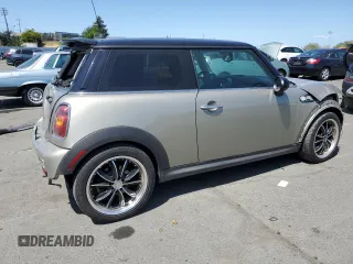 2009 MINI Hardtop S with VIN WMWMF73549TT94143, listed as a Copart auction lot 52120615 with 144,334 mi miles and Salvage Title. Bid and sale history available at DreamBid. Image 3.