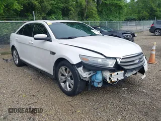 2014 Ford Taurus SEL z VIN 1FAHP2E88EG129018, wystawiony jako IAAI lot #42441984 z przebiegiem 201 330 mil mil oraz . Historia ofert i sprzedaży dostępna na DreamBid. Obrazek 1.