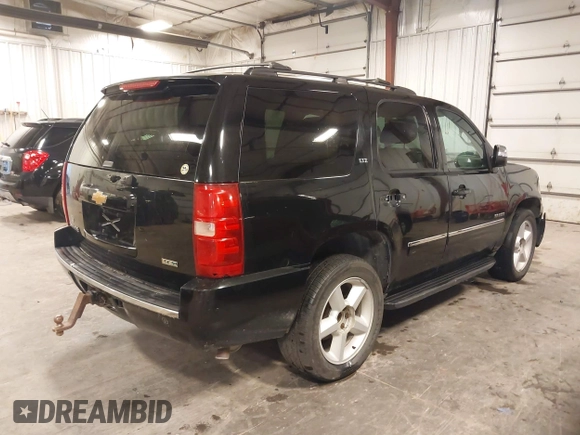 2012 Chevrolet Tahoe LTZ with VIN 1GNSKCE02CR297261, listed as a IAAI auction lot 40255137 with 283,110 mi miles and . Bid and sale history available at DreamBid. Image 4.