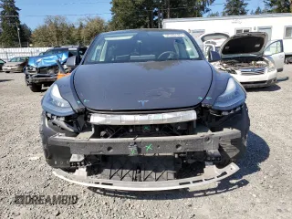 2020 Tesla Model Y Long Range with VIN 5YJYGDEEXLF017789, listed as a Copart auction lot 52705185 with 49,470 mi miles and Salvage Title. Bid and sale history available at DreamBid. Image 5.