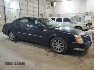 2007 Cadillac DTS Performance with VIN 1G6KD57957U156605, listed as a Copart auction lot 44777565 with 359,071 mi miles and Salvage Title. Bid and sale history available at DreamBid. Image 4.
