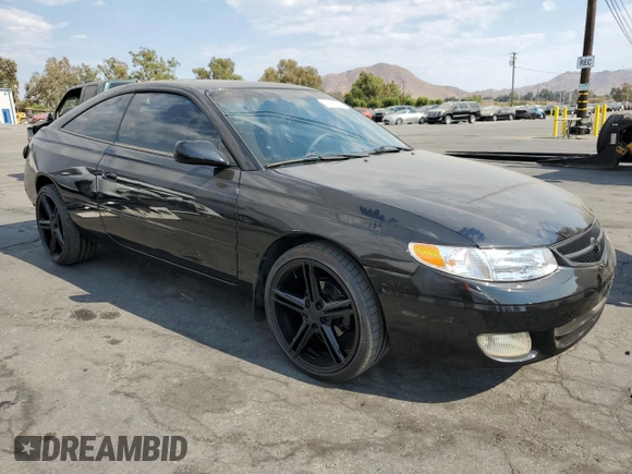 2000 Toyota Solara SE with VIN 2T1CF28P0YC337293, listed as a Copart auction lot 70659044 with 214,172 mi miles and Salvage Title. Bid and sale history available at DreamBid. Image 4.