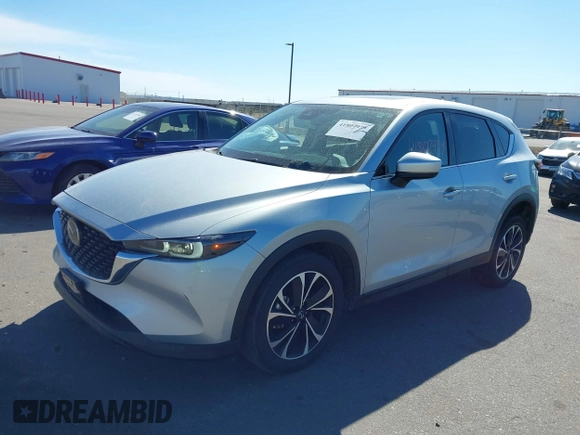 2023 Mazda CX-5 2.5 S Premium Package with VIN JM3KFBDM9P0173453, listed as a IAAI auction lot 41807979 with 34,156 mi miles. Bid and sale history available at carsss.com. Image 2.