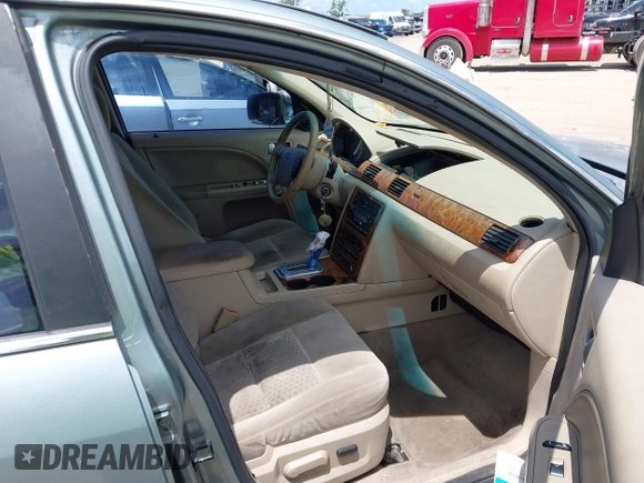 2005 Ford Five Hundred SEL z VIN 1FAFP241X5G118341, wystawiony jako IAAI lot #42012730 z przebiegiem Nie podano mil oraz . Historia ofert i sprzedaży dostępna na DreamBid. Obrazek 5.