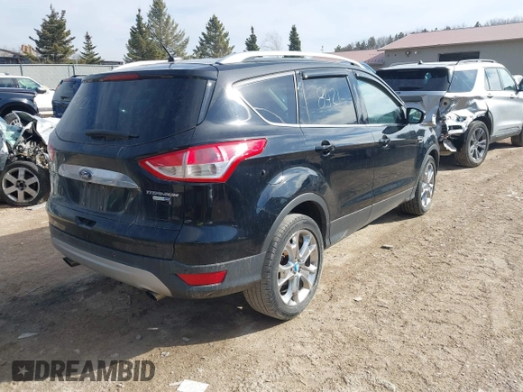 2016 Ford Escape Titanium with VIN 1FMCU9JX4GUB38303, listed as a IAAI auction lot 41788421 with 138,511 mi miles and . Bid and sale history available at DreamBid. Image 4.