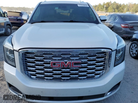 2019 GMC Yukon Denali with VIN 1GKS1CKJ8KR353280, listed as a Copart auction lot 77316454 with 74,476 mi miles and Salvage Title. Bid and sale history available at carsss.com. Image 5.