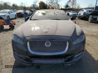 2015 Jaguar XJ with VIN SAJWJ1CD1F8V90815, listed as a Copart auction lot 77977464 with Not provided miles and Salvage title. Bid and sale history available at DreamBid. Image 5.
