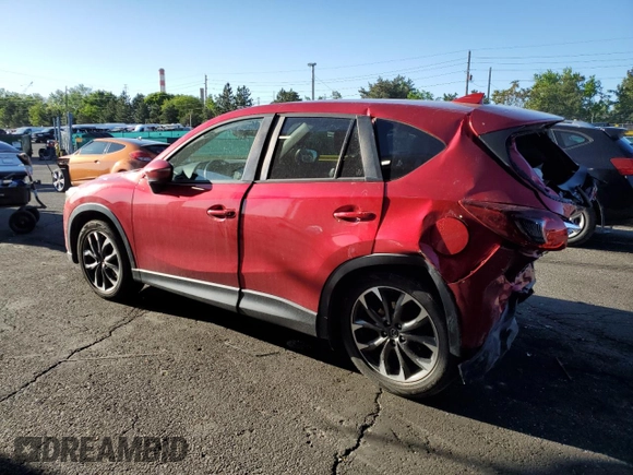 2016 Mazda CX-5 Grand Touring z VIN JM3KE4DY9G0753691, wystawiony jako Copart lot #57361645 z przebiegiem 90 733 mil mil oraz Szkoda całkowita • Salvage title. Historia ofert i sprzedaży dostępna na DreamBid. Obrazek 2.
