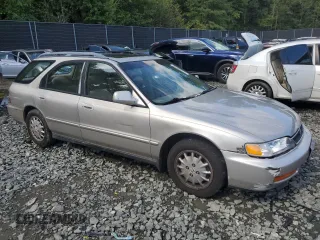 1997 Honda Accord EX with VIN 1HGCE189XVA001554, listed as a Copart auction lot 71355014 with 217,696 mi miles and Salvage Title. Bid and sale history available at carsss.com. Image 4.