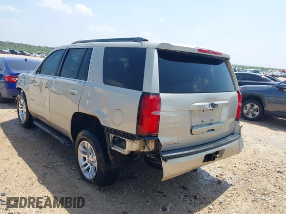 2015 Chevrolet Tahoe LS with VIN 1GNSCAKC9FR294832, listed as a IAAI auction lot 39274877 with 126,932 mi miles and . Bid and sale history available at DreamBid. Image 3.