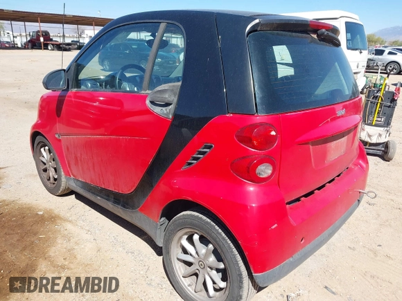 2009 Smart fortwo Pure z VIN WMEEJ31X59K291372, wystawiony jako IAAI lot #41826469 z przebiegiem 87 773 mil mil oraz . Historia ofert i sprzedaży dostępna na DreamBid. Obrazek 3.