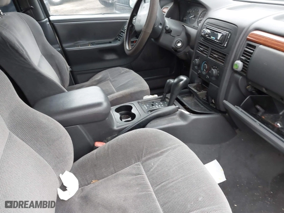 1999 Jeep Grand Cherokee Laredo with VIN 1J4GW58S9XC673310, listed as a IAAI auction lot 41927682 with 999,999 mi miles. Bid and sale history available at carsss.com. Image 5.