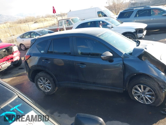 2016 Mazda CX-5 Touring with VIN JM3KE4CY0G0751040, listed as a IAAI auction lot 41290780 with 136,689 mi miles. Bid and sale history available at carsss.com. Image 14.