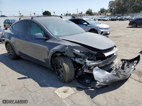 2021 Tesla Model Y Long Range with VIN 5YJYGDEEXMF070154, listed as a Copart auction lot 50742325 with 23,376 mi miles and Salvage Title. Bid and sale history available at carsss.com. Image 4.