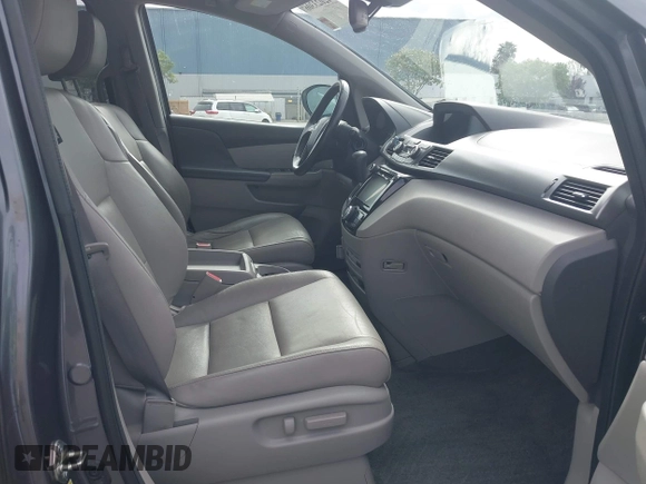 2016 Honda Odyssey EX-L with VIN 5FNRL5H68GB104350, listed as a IAAI auction lot 42023306 with 124,672 mi miles. Bid and sale history available at carsss.com. Image 5.